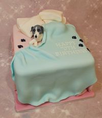 Dog in a bed cake